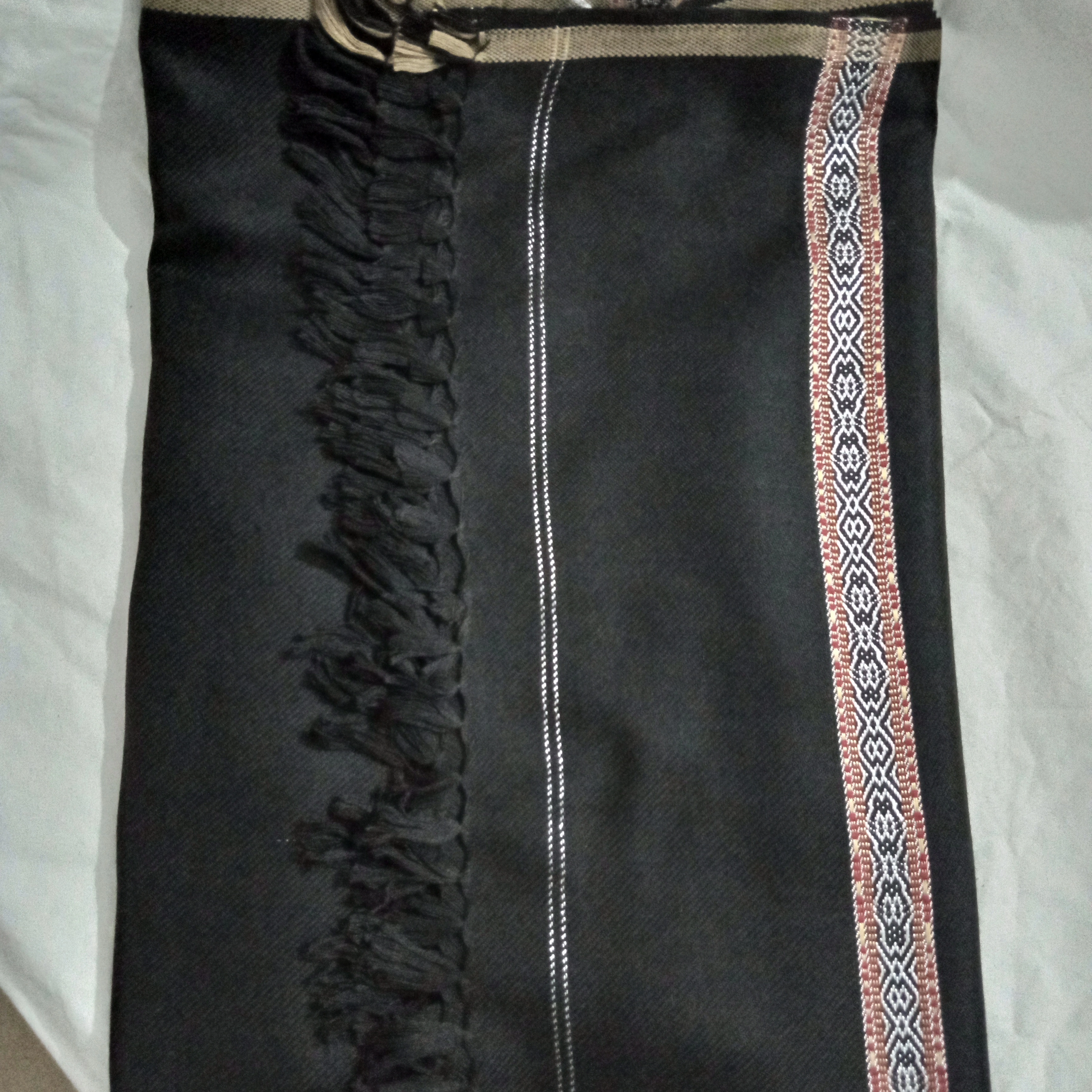 Third image of woollen black shawl.